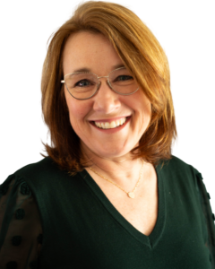 Image of a woman with glasses smiling