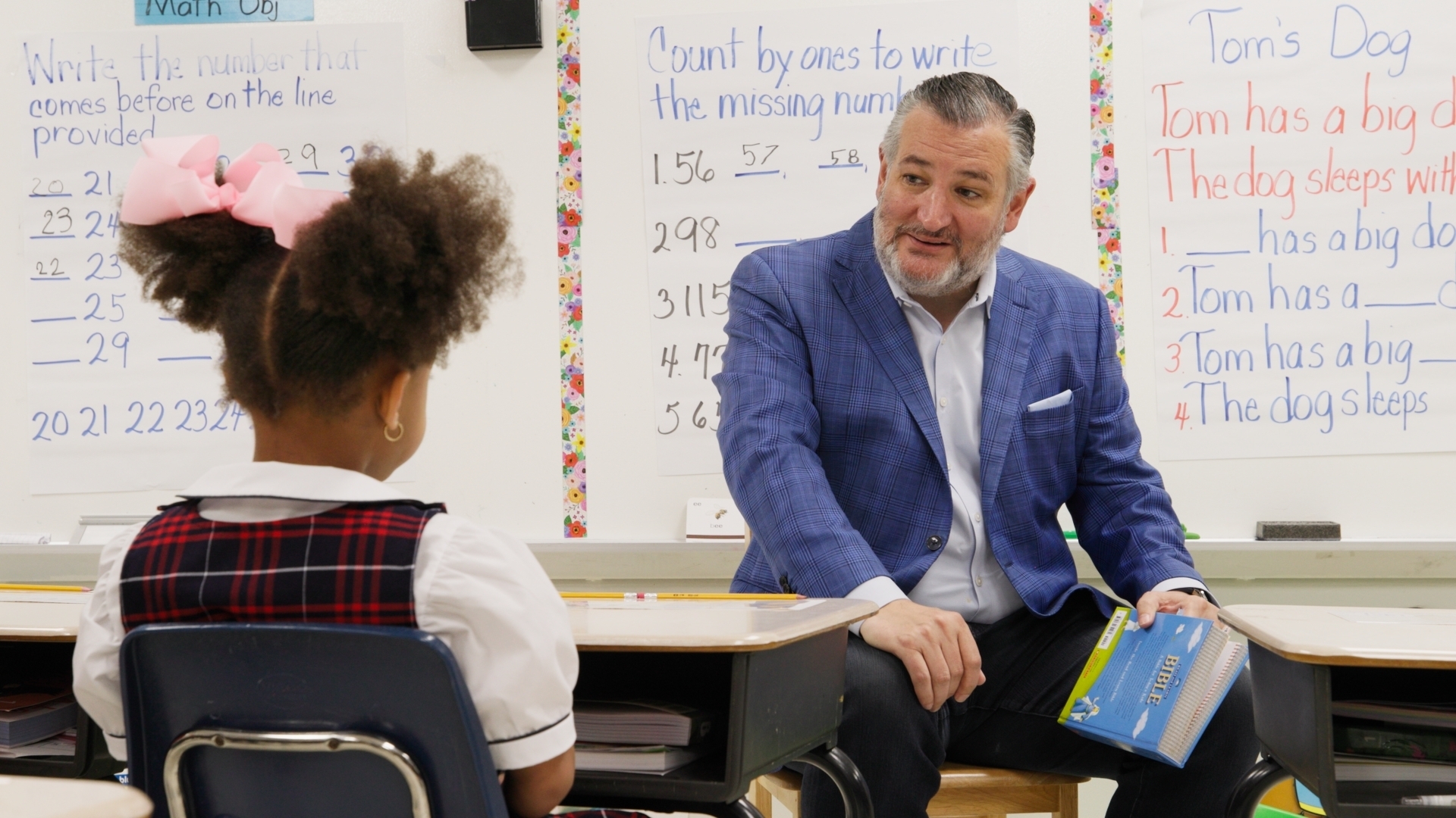 Picture of Senator Ted Cruz talking with a student in a classroom